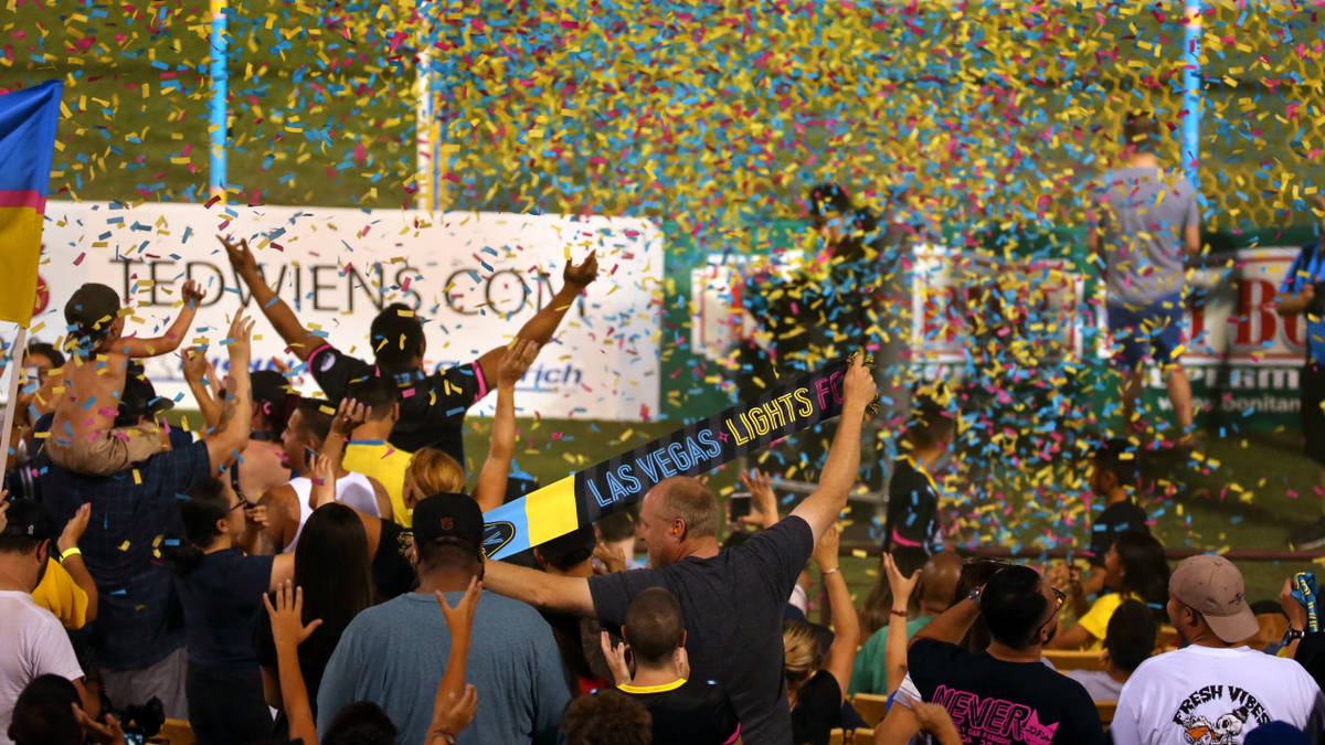 Las Vegas Lights FC fans are bathed in confetti as they celebrate their 1-0 win over Portland T ...