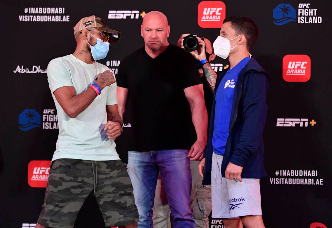 Deiveson Figueiredo, left, of Brazil and Joseph Benavidez face off during the UFC Fight Night w ...