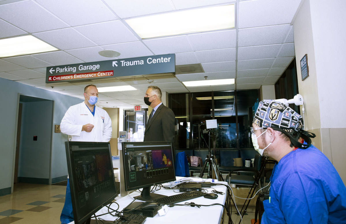 University Medical Center CEO Mason VanHouweling, center, discusses the hospital's patient volu ...