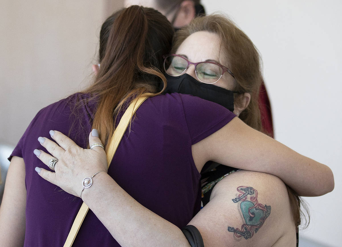 Theresa Christensen, right/facing, hugs Jamie Henderson at the conclusion of sentencing for Ray ...