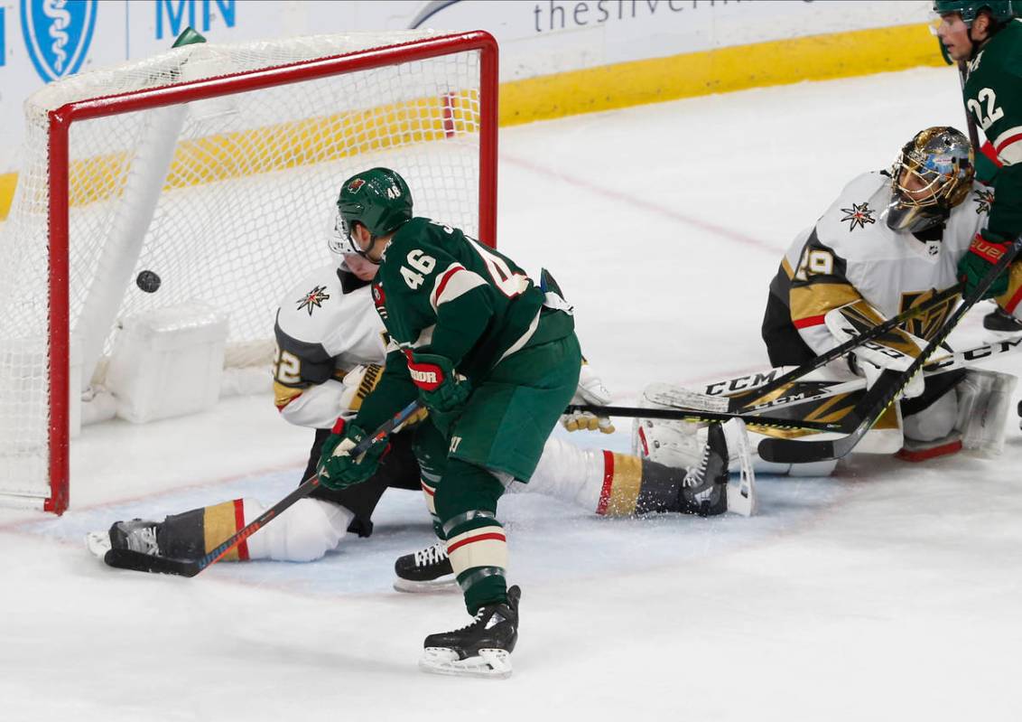 Minnesota Wild's Jared Spurgeon, left, scores a power play goal against Vegas Golden Knights' g ...