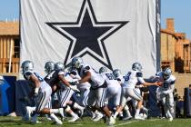 FILE - In this Monday, July 29, 2019, file photo, Dallas Cowboys practice at the NFL football t ...