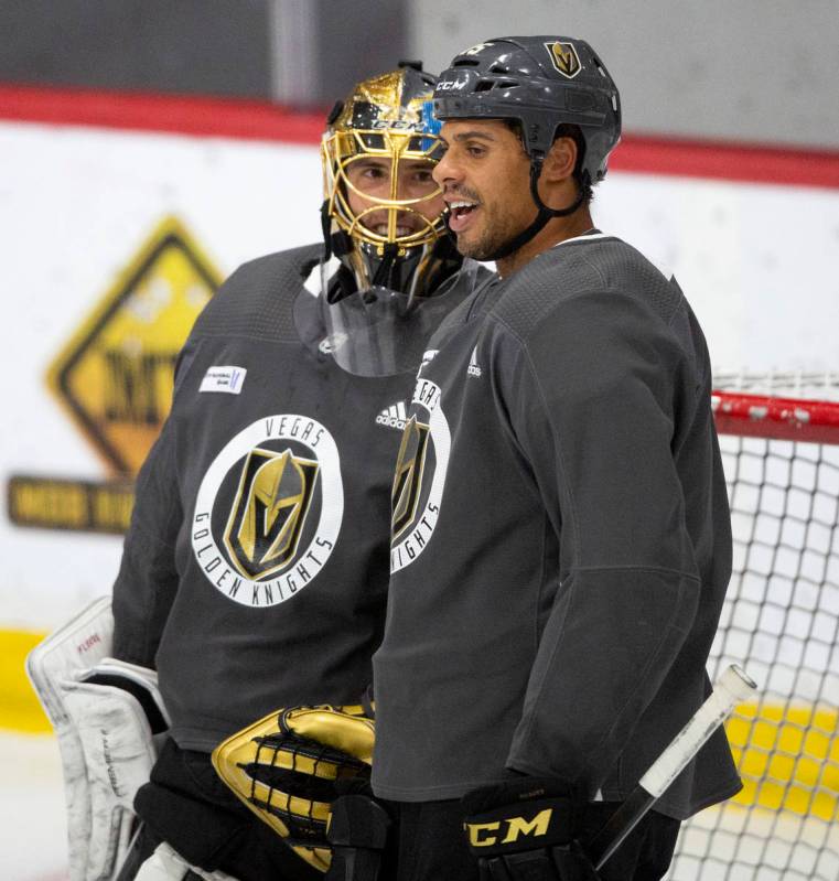 Golden Knights' goaltender Marc-Andre Fleury (29) and forward Ryan Reaves (75) chat during prac ...