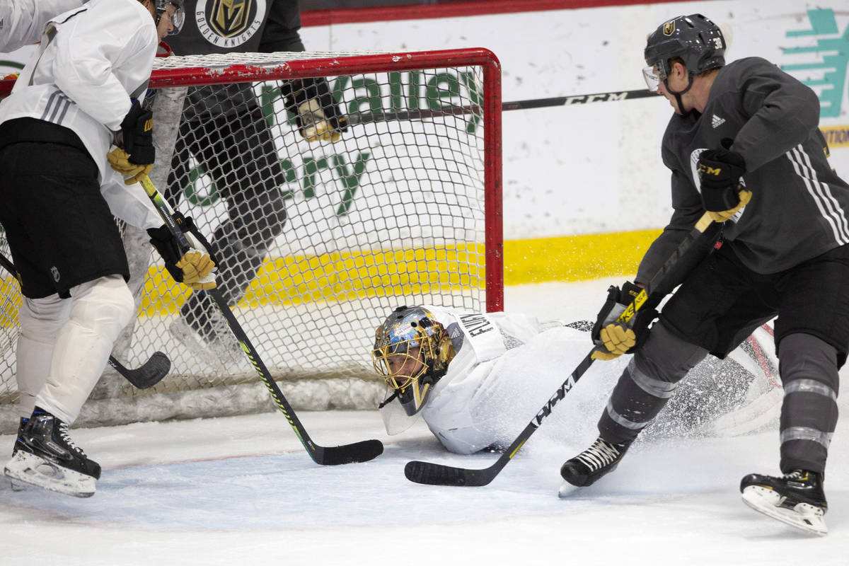 Golden Knights' goaltender Marc-Andre Fleury (29) dives to save the puck during practice at Cit ...
