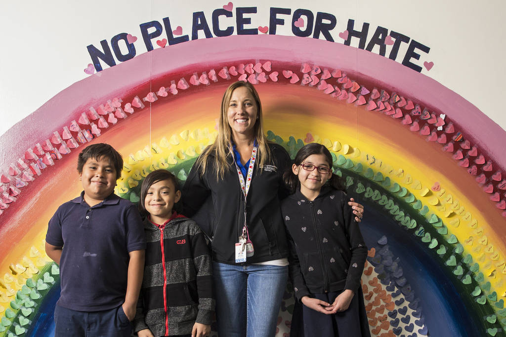 Teacher Rhonda Martines with students Roberto, left, Carlos and Gissele in front of the No Plac ...
