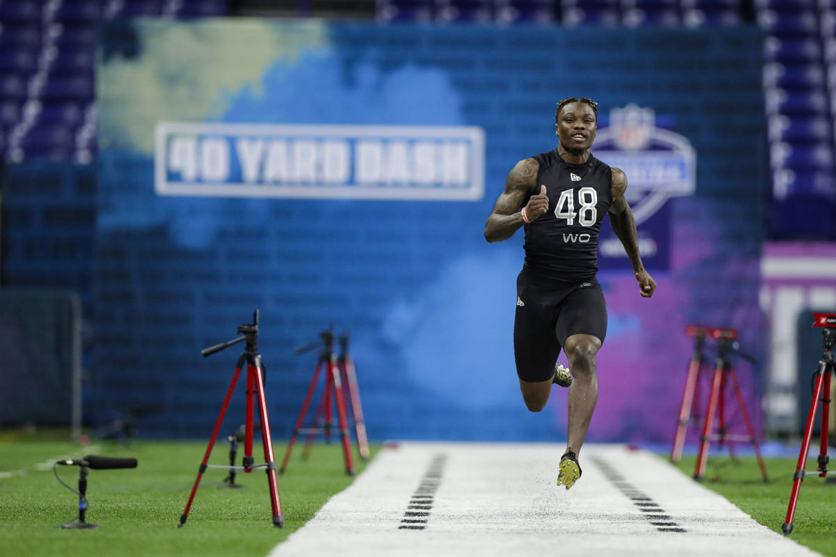 Alabama wide receiver Henry Ruggs III runs the 40-yard dash at the NFL football scouting combin ...