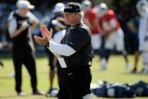 Raiders head coach Jon Gruden claps during a combined NFL football training camp with the Rams ...