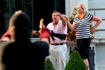 FILE - In this June 28, 2020 file photo, armed homeowners Mark and Patricia McCloskey, standing ...