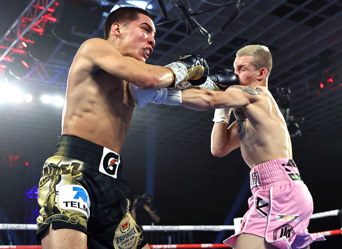 Oscar Valdez, left, and Jayson Velez trade punches during their junior lightweight fight on Tue ...