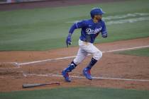 Los Angeles Dodgers' Mookie Betts lines out to center field during the fourth inning of an exhi ...