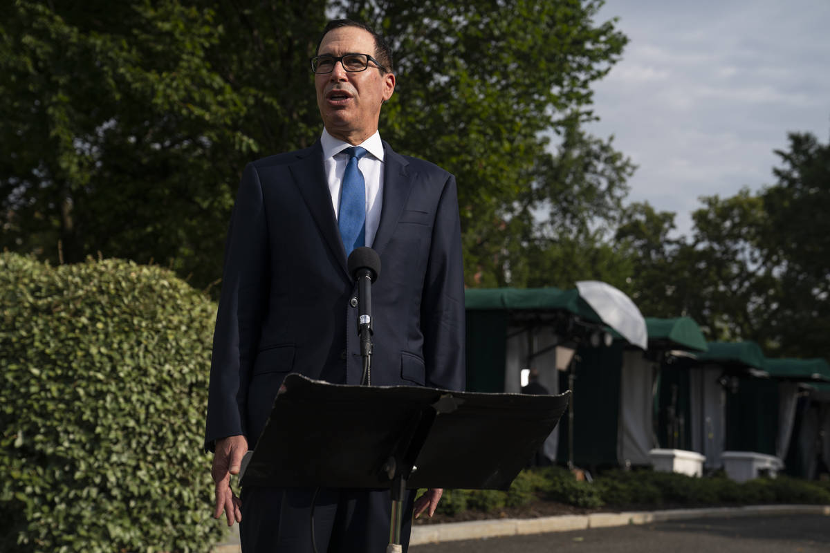 Treasury Secretary Steven Mnuchin speaks with reporters about the coronavirus relief package ne ...