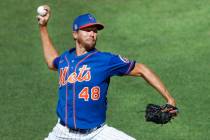 New York Mets starting pitcher Jacob deGrom (48) winds up while delivering a pitch during a sim ...