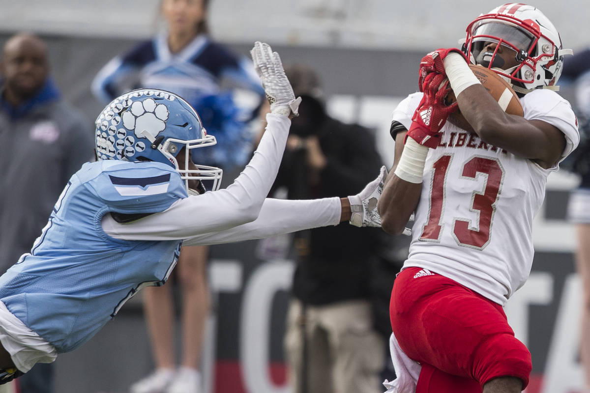 Liberty junior wide receiver Corey Hebert (13) beats Centennial junior cornerback Tyrone McCoy ...