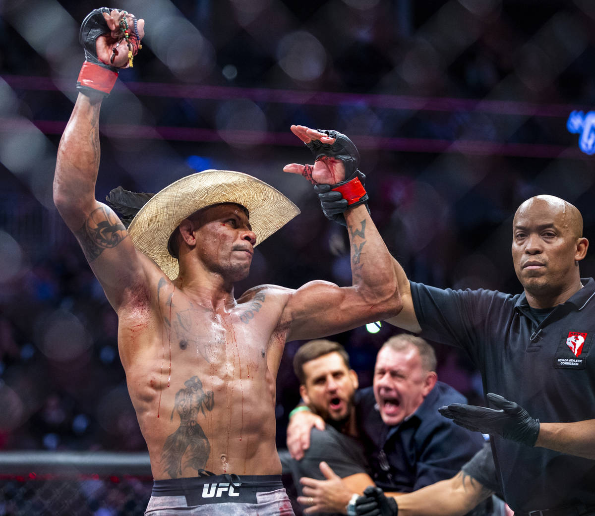 Welterweight Alex Oliveira celebrates his win after battling Max Griffin during their UFC 248 f ...