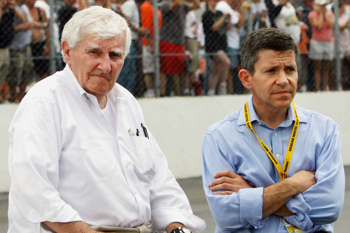 Owners of New Hampshire International speedway Bob Bahre, left, and son Gary Bahre wait out a r ...