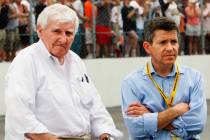 Owners of New Hampshire International speedway Bob Bahre, left, and son Gary Bahre wait out a r ...