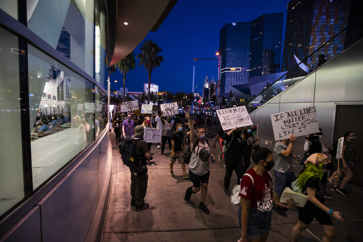 People participate during a Black Lives Matter rally on the Las Vegas Strip on Saturday, July 2 ...