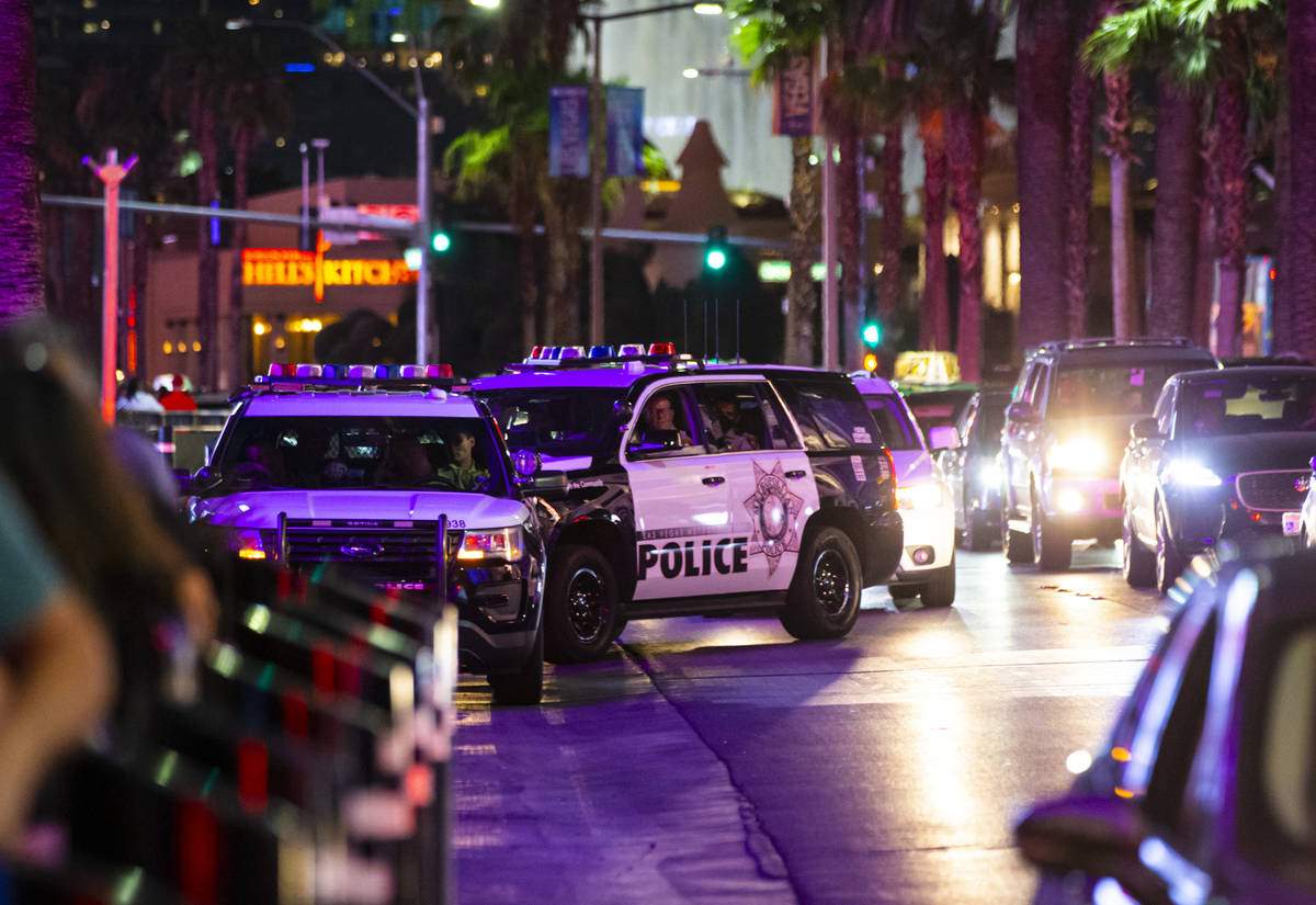 Las Vegas police watch people march during a Black Lives Matter rally on the Las Vegas Strip on ...