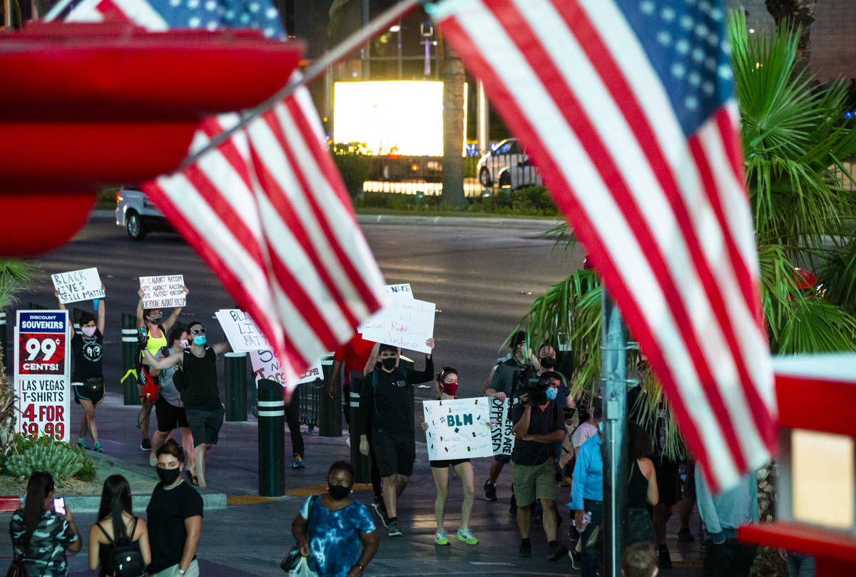 People march during a Black Lives Matter rally on the Las Vegas Strip on Saturday, July 25, 202 ...