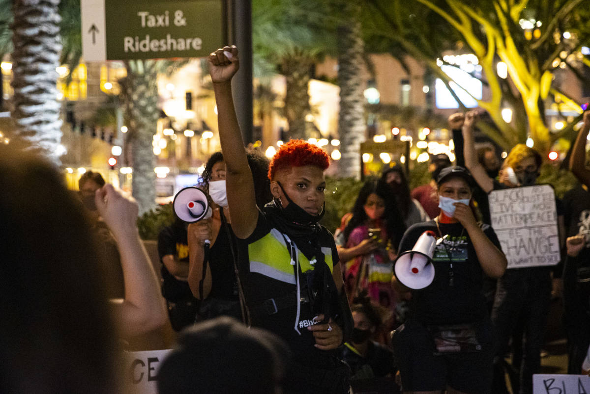 Zyera Dorsey raises her fist during a Black Lives Matter march on the Las Vegas Strip on Saturd ...