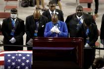 Fraternity members sing in front of the casket of the late Rep. John Lewis, D-Ga., during a ser ...