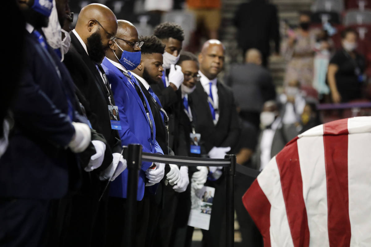 Fraternity members sing in front of the casket of the late Rep. John Lewis, D-Ga., during a ser ...