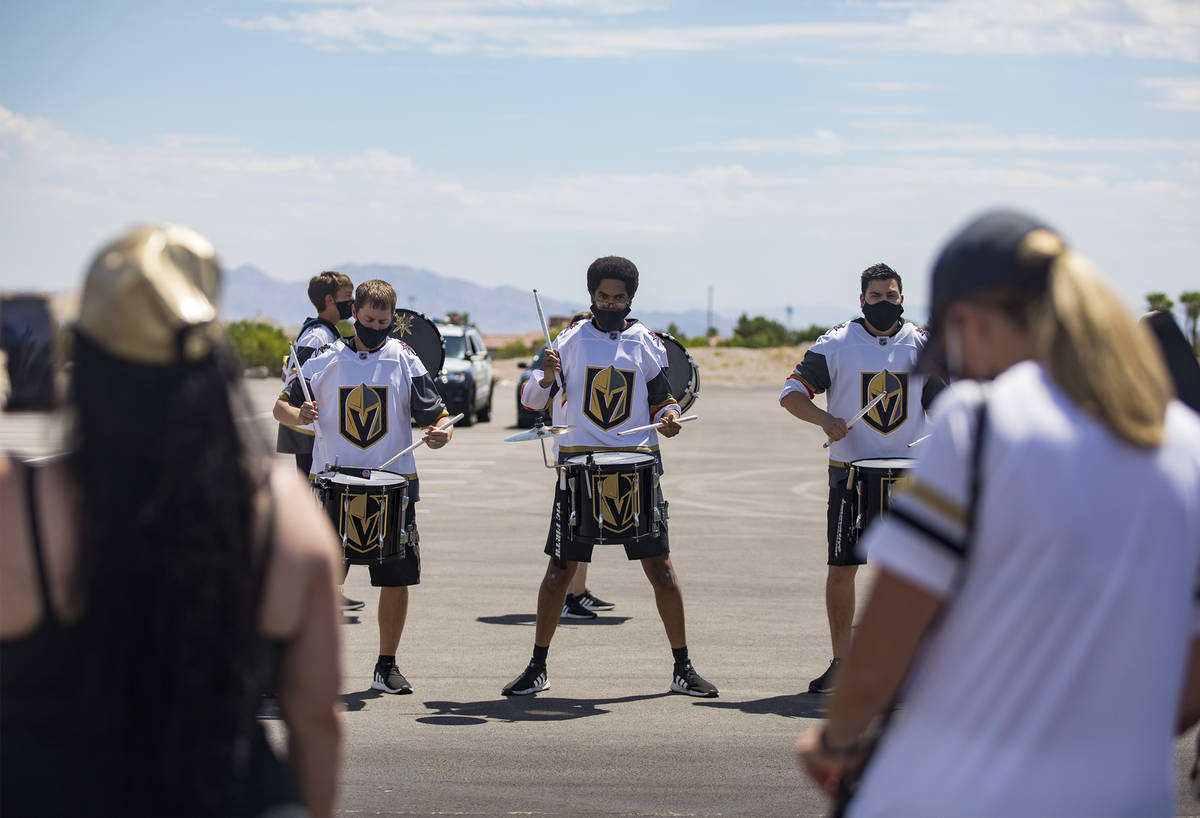 The Golden Knights drum line performs for fans as they wait to send off Golden Knights players ...