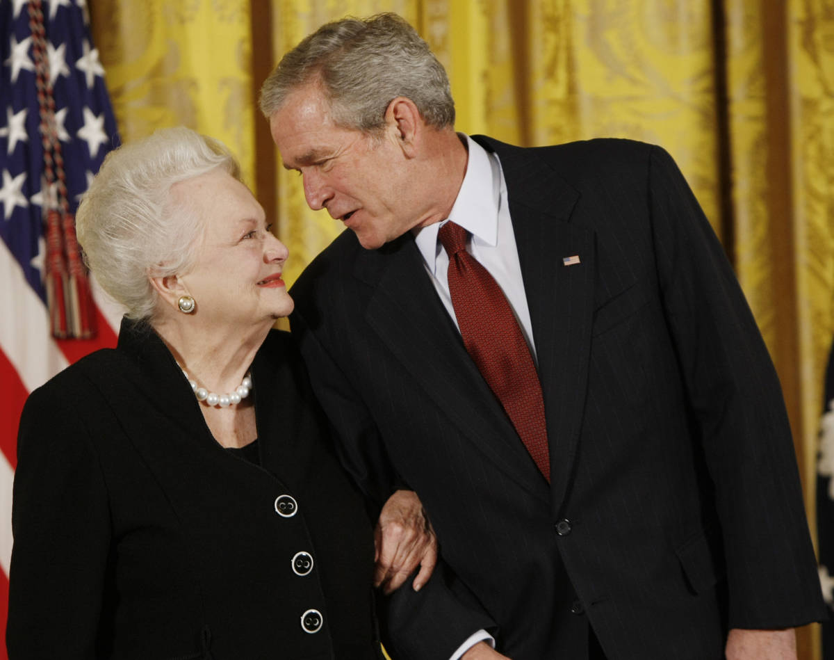 President George W. Bush greets actress Olivia de Havilland as he presented her with the 2008 N ...