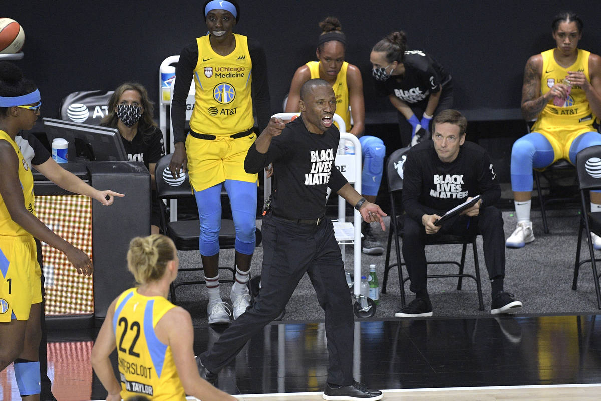 Chicago Sky head coach James Wade, center, reacts after a play during the first half of a WNBA ...