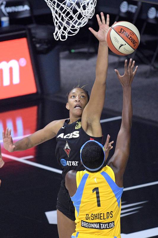 Las Vegas Aces forward A'ja Wilson, top, defends as Chicago Sky guard Diamond DeShields (1) goe ...