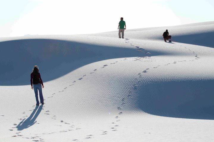 Visitors hike the shifting dunes of White Sands National Monument near Alamogordo, N.M., in 201 ...