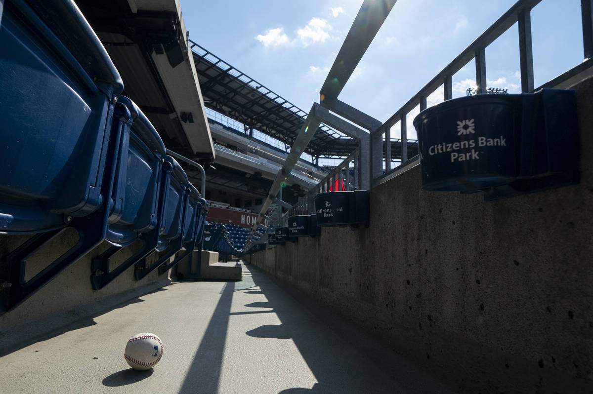 A foul ball that was hit into the stands sits on the floor of an empty stadium during the eight ...