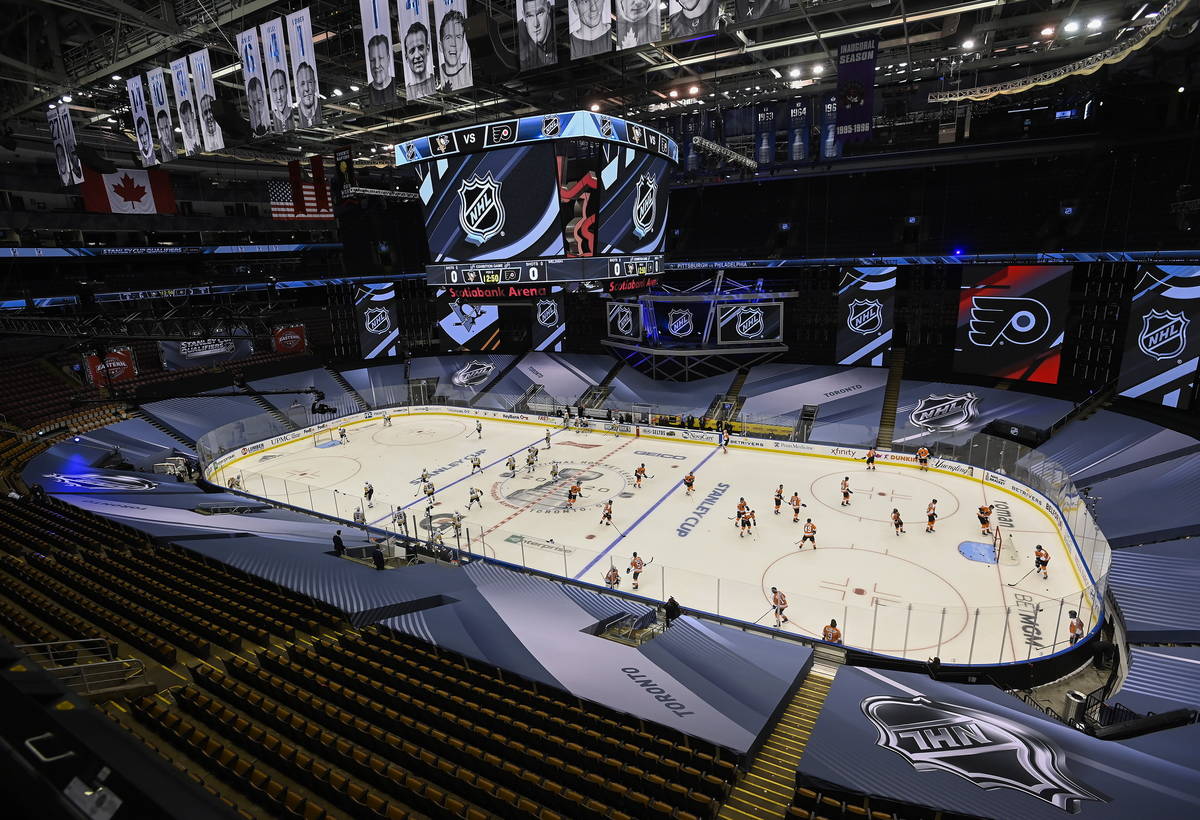 The Pittsburgh Penguins, left, and Philadelphia Flyers warm up before an exhibition NHL hockey ...