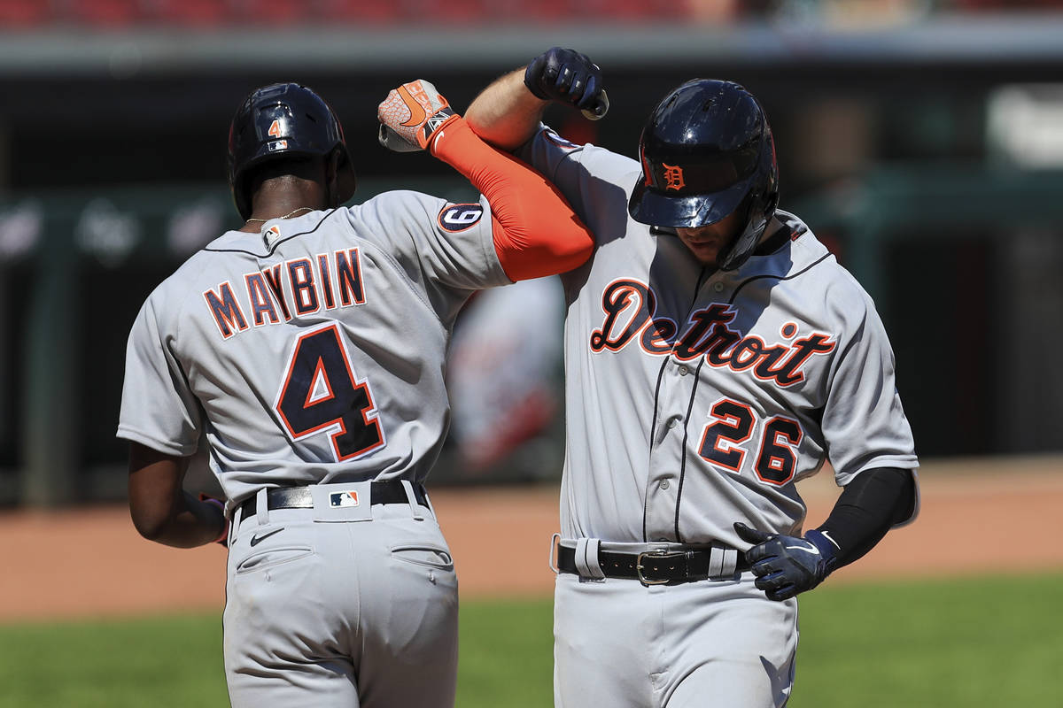 Detroit Tigers' C.J. Cron (26) celebrates with Cameron Maybin (4) after hitting a two-run home ...