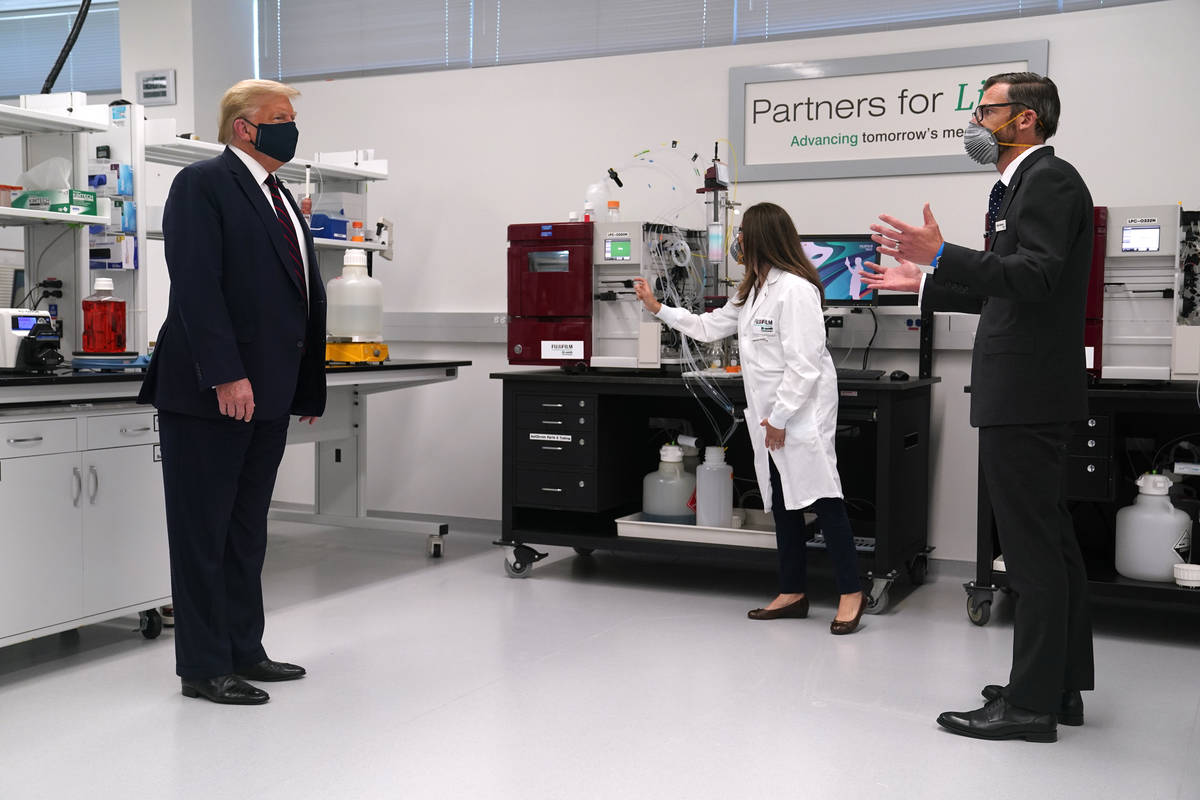 Fujifilm Diosynth Biotechnologies CEO Martin Meeson, right, speaks as President Donald Trump we ...