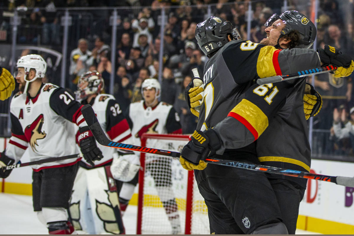 In this Dec. 22, 2019, file photo, Vegas Golden Knights left wing Max Pacioretty (67, left) cel ...