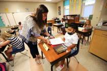 Corinth Elementary School third grade teacher Brooke Marlar helps her new student Navaeh Malone ...