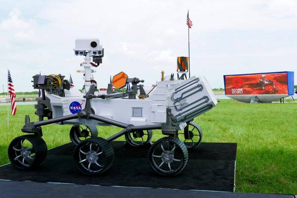 A replica of the Mars rover Perseverance is displayed outside the press site before a news conf ...