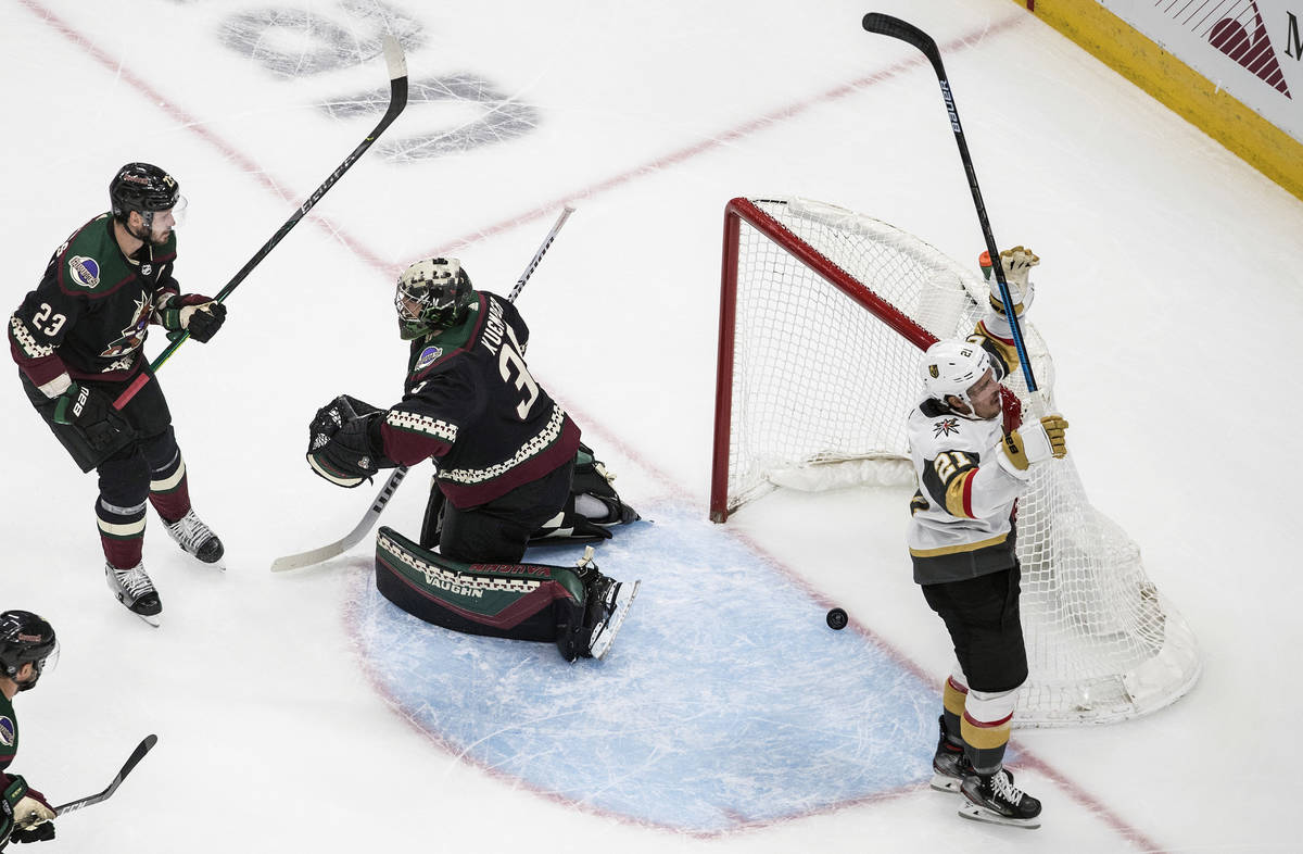 Arizona Coyotes goalie Darcy Kuemper (35) is scored on as Vegas Golden Knights' Nick Cousins (2 ...