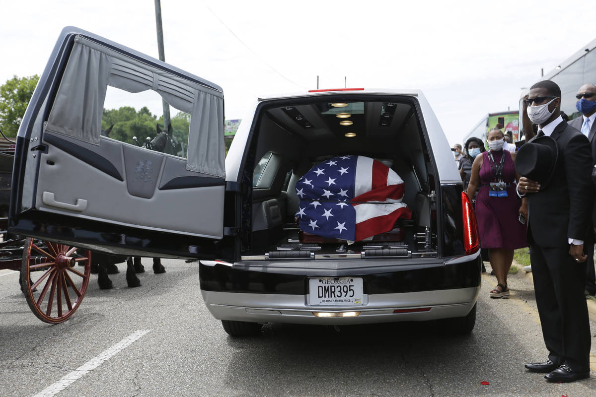 The casket of Rep. John Lewis sits in a hearse during a memorial service for Lewis, Sunday, Jul ...