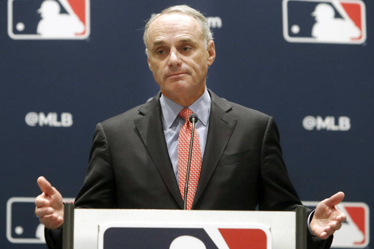 In this Nov. 21, 2019, file photo, baseball commissioner Rob Manfred speaks to the media at the ...