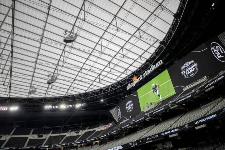 A video screen above the south end zone at Allegiant Stadium on Friday, Aug. 21, 2020, in Las V ...