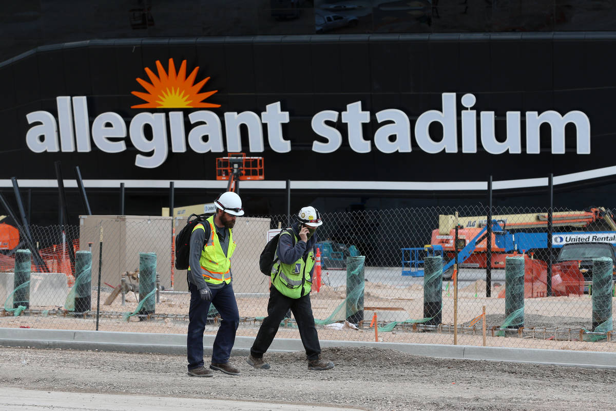 Workers leave at the end of their shift at the Raiders Allegiant Stadium in Las Vegas, Wednesda ...