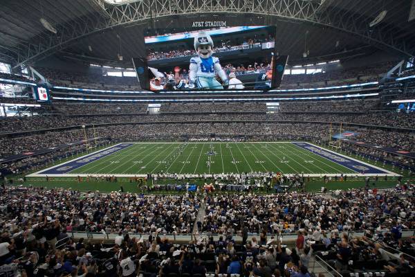 Rowdy, the Dallas Cowboys mascot is displayed on the large video screen at AT&T Stadium at ...