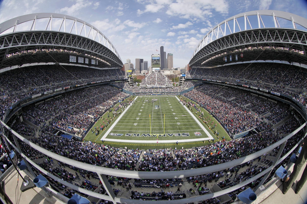 In this Oct. 2, 2011, file photo, taken with a fisheyelens, the Seattle Seahawks and Atlanta Fa ...