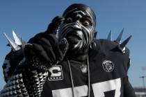 Oakland Raiders fan Violator poses for photos while tailgating at RingCentral Coliseum before a ...