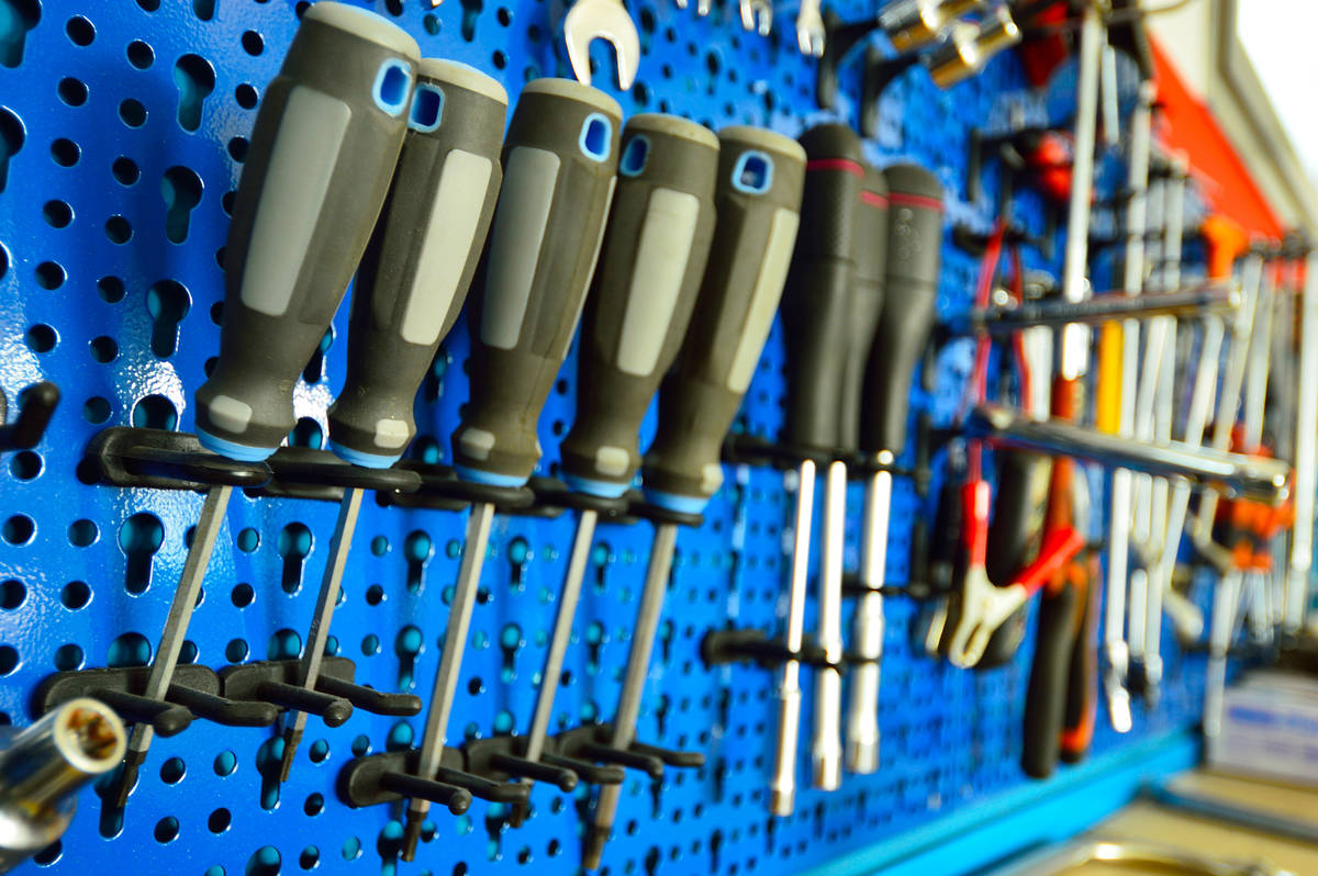 This metal pegboard keeps tools organized and easy to find. (Getty Images)