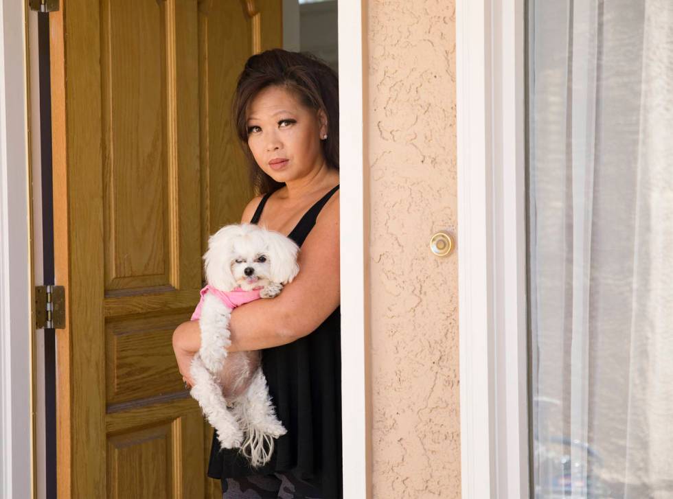 Michelle Lau with her dog Abigail at her home in Las Vegas, Thursday, July 30, 2020. (Rachel A ...