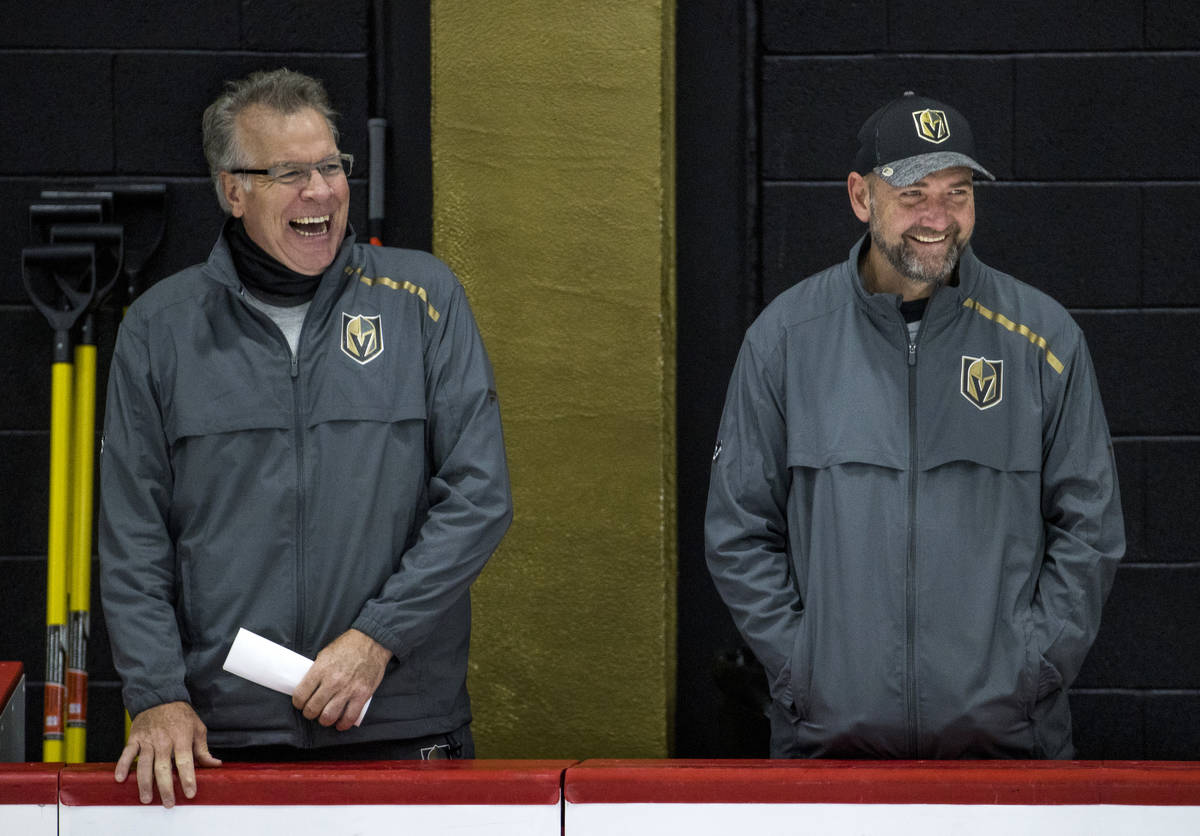 Vegas Golden Knights head coach Peter DeBoer, right, laughs with assistant head coach Ryan McGi ...