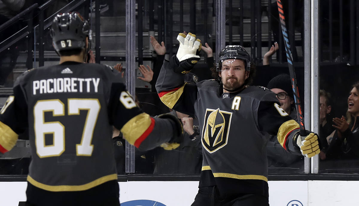 Vegas Golden Knights right wing Mark Stone, right, celebrates with left wing Max Pacioretty aft ...